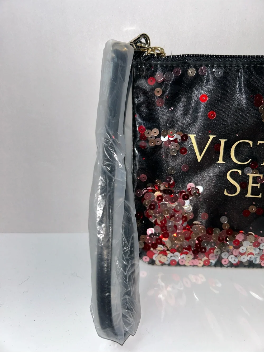 Victoria's Secret Floating Confetti Sequin Wristlet Pouch.